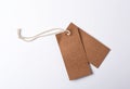 empty paper brown tag on the rope, white background Royalty Free Stock Photo