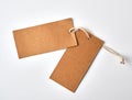 empty paper brown tag on the rope, white background Royalty Free Stock Photo