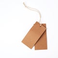 empty paper brown tag on the rope, white background Royalty Free Stock Photo