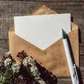 An empty paper postcard, an envelope and alissum flowers on a wooden background, a postcard layout with a place to copy Royalty Free Stock Photo