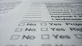 Empty paper questionnaire closeup. Unfilled checklist with places for checkmarks