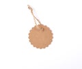 empty paper round brown tag on a rope, white background Royalty Free Stock Photo