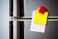 Empty paper sheet on refrigerator door with magnetic clip paper note for add text message Royalty Free Stock Photo