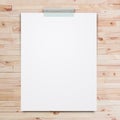 Empty paper sheet stick on wood background.