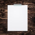 Empty paper sheet stick on wood background.