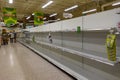 Empty paper towel and toilet paper display shelves at a Publix grocery store due to the people panicing and hoarding paper and