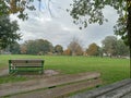 Empty park on autumn in a rainy day with overcast sky Royalty Free Stock Photo