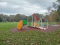 Empty park on autumn in a rainy day with overcast sky Royalty Free Stock Photo