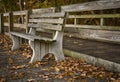 An empty park bench during Autumn.