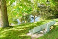 Empty park bench seat overlooking lake Royalty Free Stock Photo