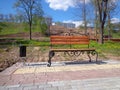 Empty park bench in spring morning Royalty Free Stock Photo