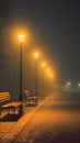 Empty Park Benches at Night With Classic Street Lamps in Foggy Sky Royalty Free Stock Photo