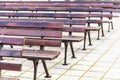 Empty park benches rows in front of an open air stage. Bulgaria, Bourgas, Sea Garden. Royalty Free Stock Photo