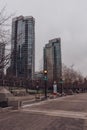 Empty park in downtown with benches and skyscrapers in Vancouver