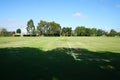 A park with a hollow soccer goal post