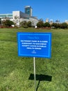 Empty park with informative signage during COVID-19 pandemic.