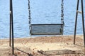 Empty park swing in the daytime Royalty Free Stock Photo