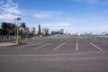 Empty Parking Lot Against City Skyline at Harbor