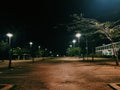 An empty parking lot in the middle of the night.