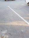 Empty parking space with white marking lines on the asphalt, vertical Royalty Free Stock Photo