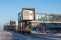 Empty passenger jet bridges at airport apron at winter