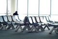 Empty passenger waiting seats in lounge after check-in next to air plane gate Royalty Free Stock Photo