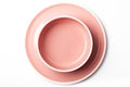 Empty pastel pink plate and bowl on white background Royalty Free Stock Photo