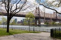 Empty Path at Queensbridge Park along the East River with the Queensboro Bridge during Spring in Long Island City Queens New York