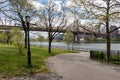Empty Path at Queensbridge Park along the East River with the Queensboro Bridge during Spring in Long Island City Queens New York Royalty Free Stock Photo