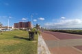 Empty Paved Promenade against Blue Cloudy Coastal City Skyline Royalty Free Stock Photo