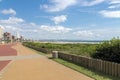 Empty Paved Promenade Against Coastal City Skyline Royalty Free Stock Photo