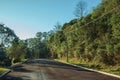 Empty paved street with high-voltage power poles Royalty Free Stock Photo