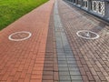 Empty pavement with bike lane and pedestrian signs Royalty Free Stock Photo