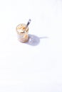 Empty peanut butter jar with spoon inside on white table background Royalty Free Stock Photo