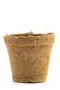 Empty peat pot isolated on a pure white background