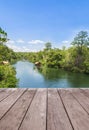 Wooden balcony terrace floor with bamboo raft hut floating in river Royalty Free Stock Photo