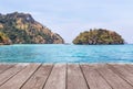 old wooden balcony terrace with sand beach and tropical sea with limestone