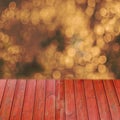 Empty perspective red wood over blurred trees with bokeh background, for product display montage Royalty Free Stock Photo