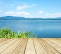 Empty perspective wood over lake and blue sky background, spring Royalty Free Stock Photo