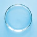 Empty Petri dish in laboratory on blue. Chemical experiment. Close up