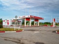 An empty petrol station in corporate red and white Lukoil colors