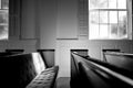 Empty pew bench seating in small church