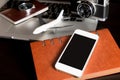 Empty phone on business travel working desk Royalty Free Stock Photo