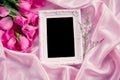 Empty photo frame with bouquet sweet pink roses petal on soft Royalty Free Stock Photo