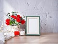 Empty photo frame candles artificial red rose on bike toy on wood table, cement texture background, gray color ,copy space for le Royalty Free Stock Photo