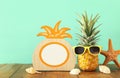 Empty photo frame and funny pineapple with sunglasses. For photography and scrapbook montage Royalty Free Stock Photo