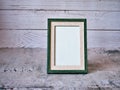 Empty photo frame on table with vintage style ,old photo ,card design, gray background, ,copy space for letter message text word , Royalty Free Stock Photo