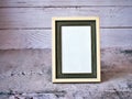Empty photo frame on table with vintage style ,old photo ,card design, gray background, ,copy space for letter message text word , Royalty Free Stock Photo