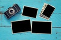 empty photo frames next to old camera Royalty Free Stock Photo