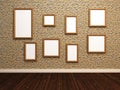 Empty photo frames on stone tile wall.